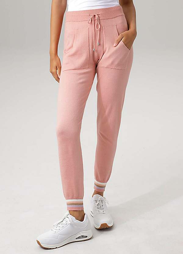 Pink joggers store with white stripe