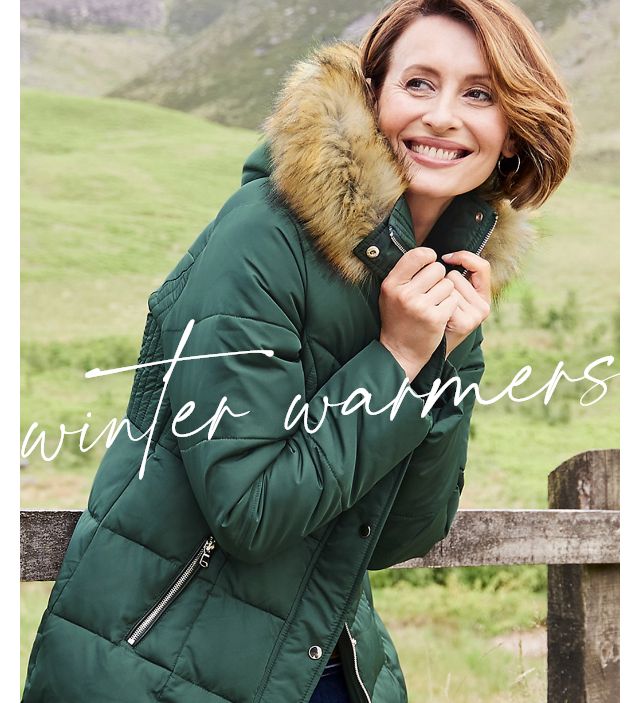 Green winter coat store with fur hood